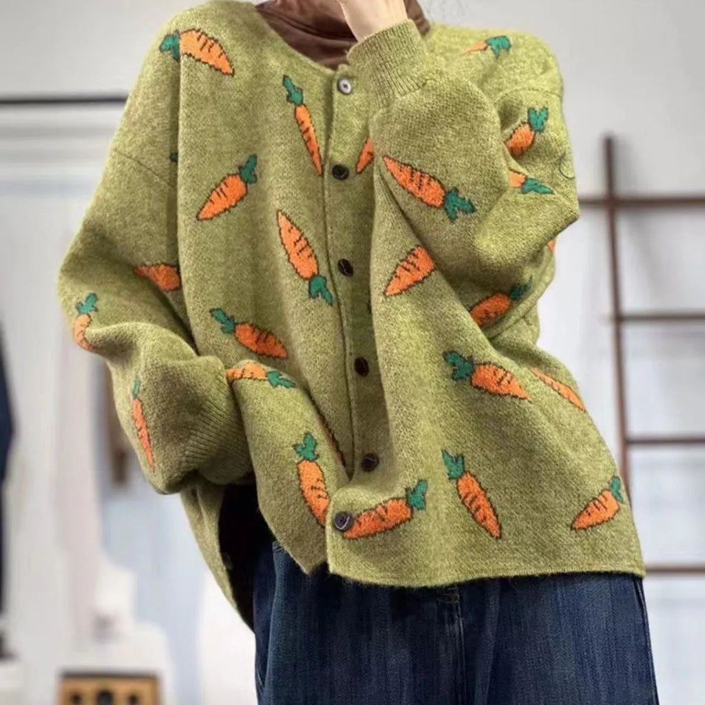 Loose grey cardigan with artistic colour-block printing, round neck, and regular sleeves.