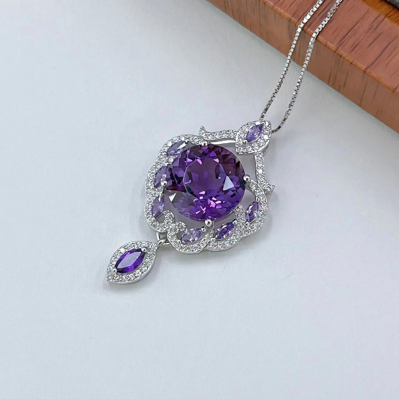Close-up of a purple amethyst gemstone set in a U-shaped platinum-plated S925 silver pendant with meteor shower detailing.