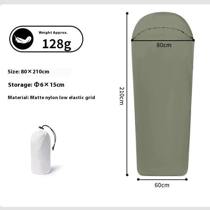 Blue mummy-style nylon camping sleeping bag unrolled, showing tapered shape and stuff sack.