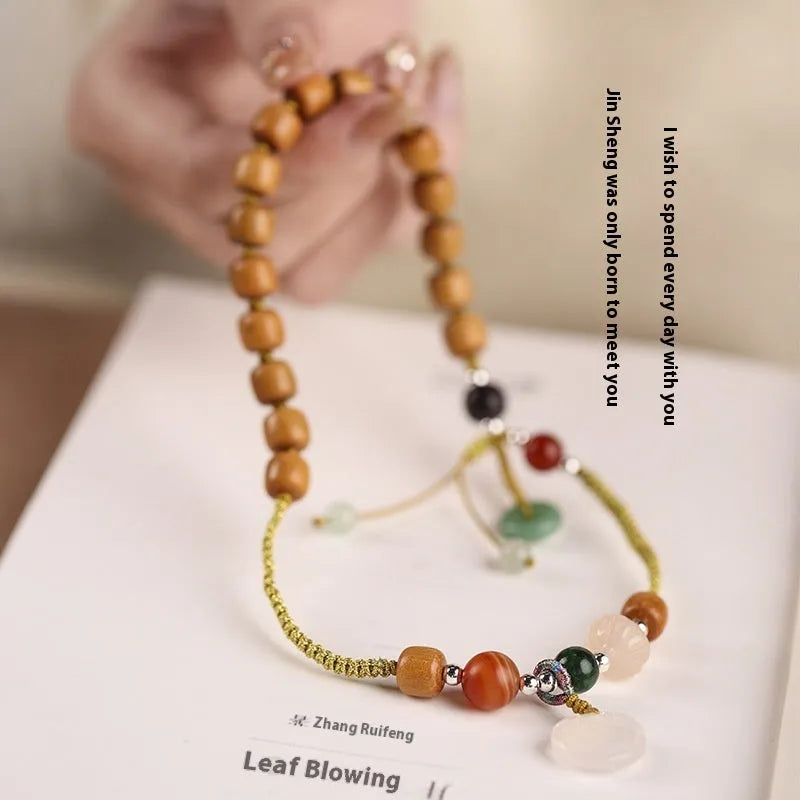 Hand-woven ebony double ring bracelet with traditional jade beads and Ruyi charm elements