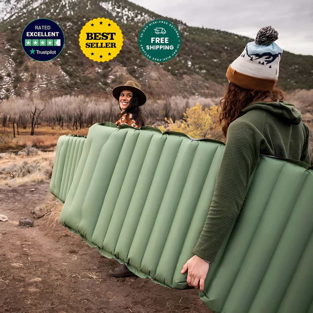 Single inflatable camping mattress in grey colour, shown expanded to its full size.