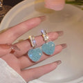 Peach heart-shaped alloy earrings for women in pink or blue candy stud styles