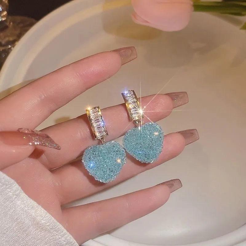 Peach heart-shaped alloy earrings for women in pink or blue candy stud styles