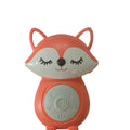 Koala-shaped infant white noise player toy in fox colour on a surface
