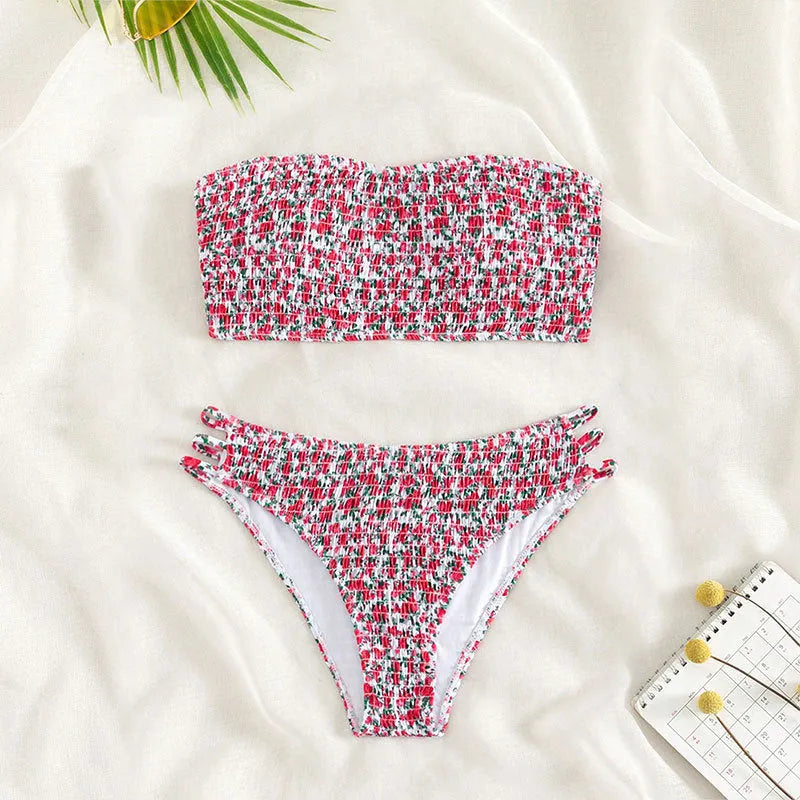 Women's strapless floral swimsuit with high-waist briefs and back split detail.