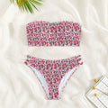 Women's strapless floral swimsuit with high-waist briefs and back split detail.