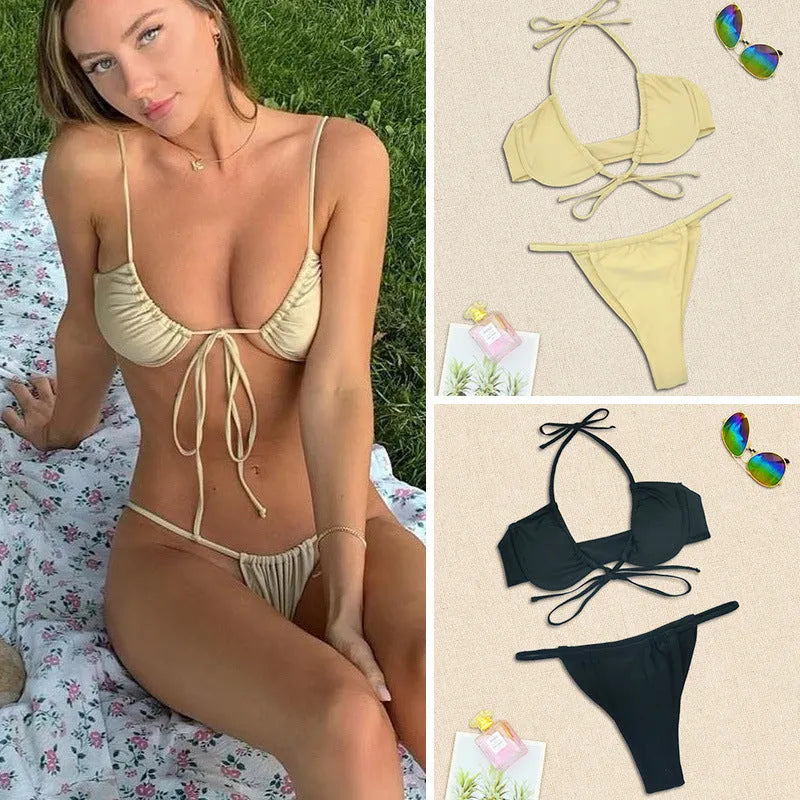 Women's black and mint green two-piece nylon bikini swimsuit set on a white background.