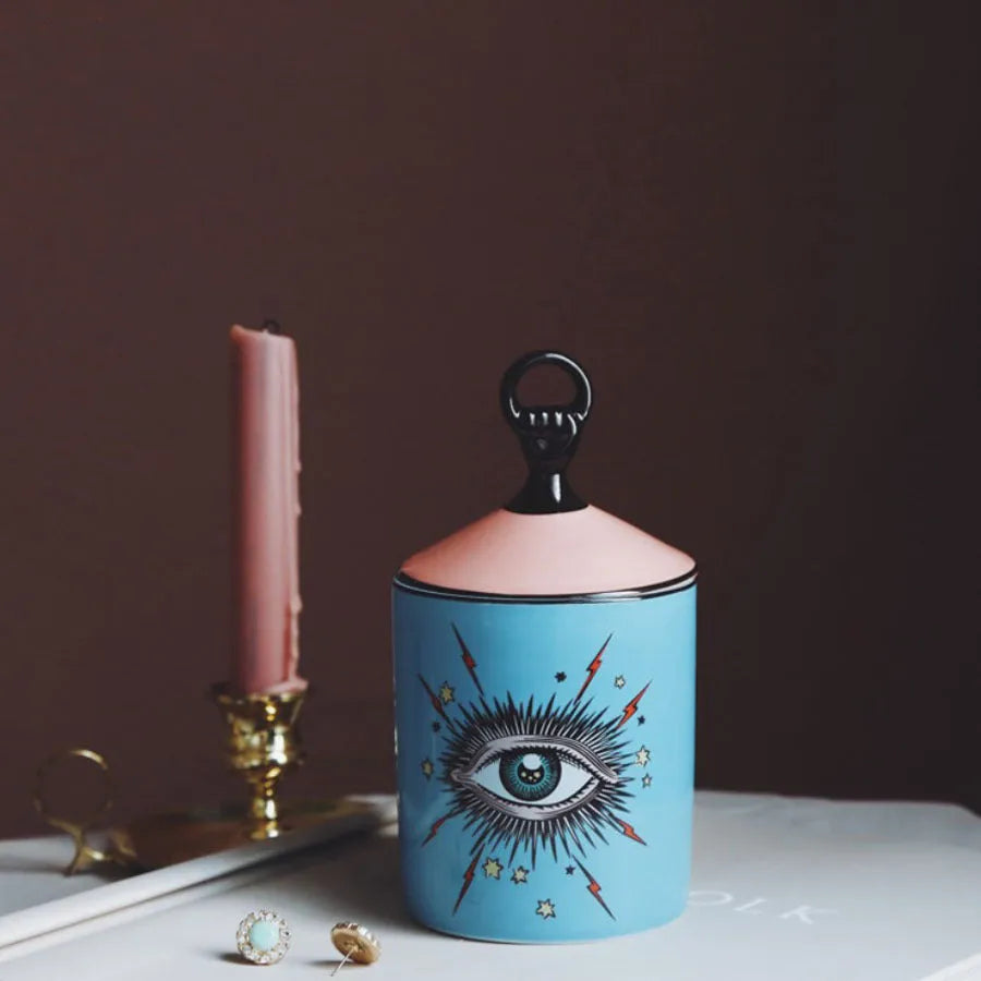 Ceramic Big Eyes candle holder with decal pattern in blue standing on a surface