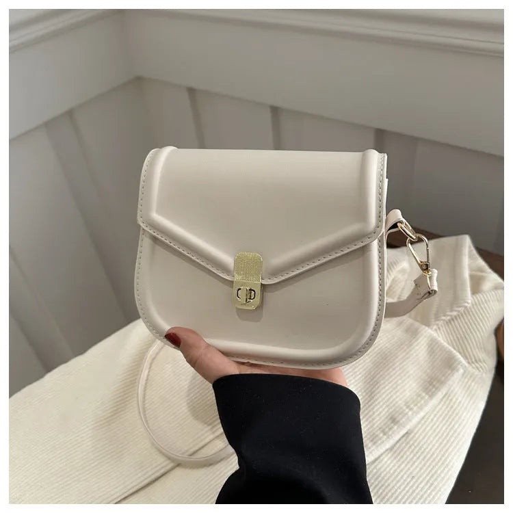 Soft PU clamshell messenger bag in horizontal square shape on a shoulder strap.
