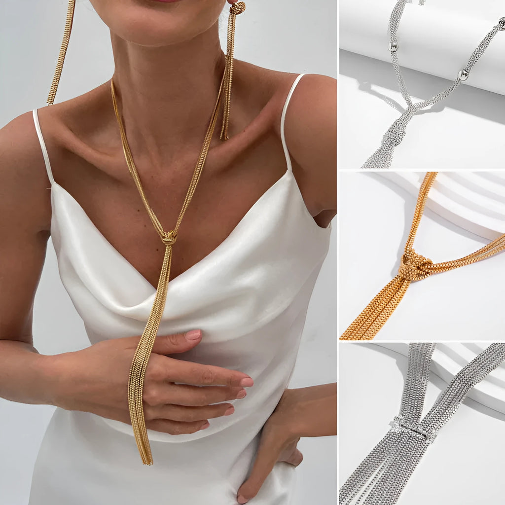 Simple Y-shaped metal tassel necklace set with gold finish and matching earrings on white background