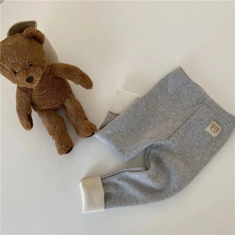 Girls' high-waist fleece-lined winter leggings in beige, black, brown, and grey with a hair band belt.