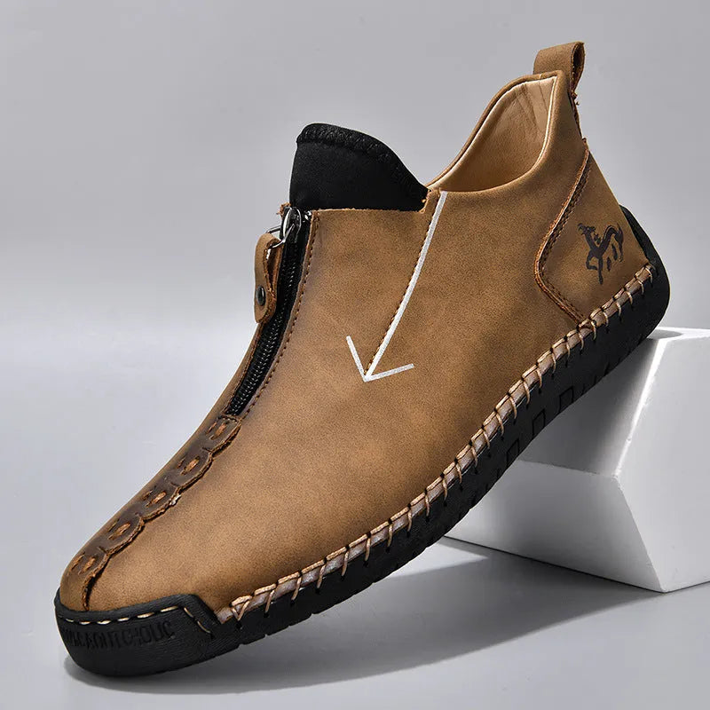 Men's brown front-zipper Martin boots with a round toe and mid-calf height on a rubber sole.