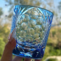 Hand carved crystal whiskey shot glass in sky blue with crane motif, 90x100mm