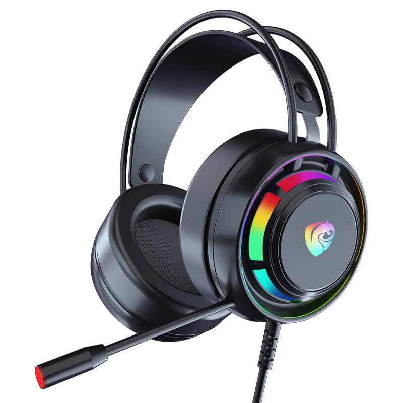Black wired computer headphones with microphone, showing 3.5mm and USB plug options on a desk.
