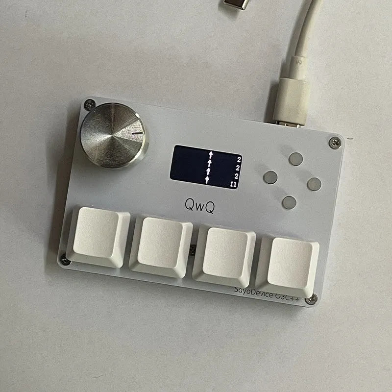 Customisable magnetic axis numeric keyboard with programmable knob and colour screen in black, pink, silver, or white.