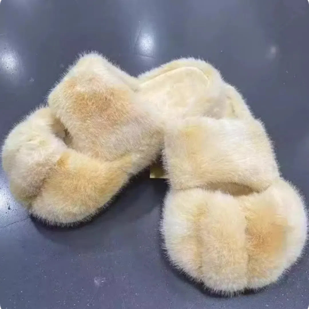 Cat paw fleece-lined slippers in yellow with non-slip sole on a floor