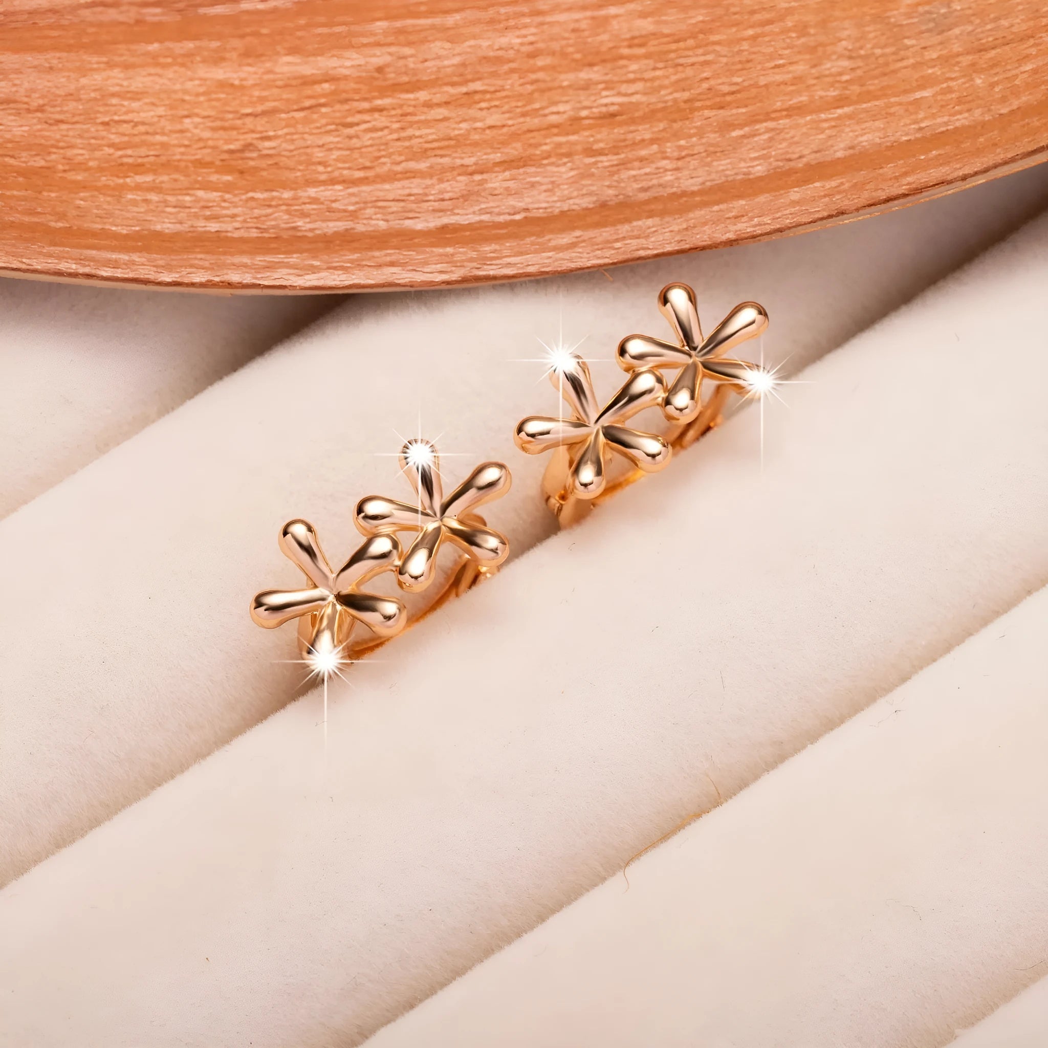 Rose gold electroplated waterdrop flower earrings with circular 20mm floral design on a white background.