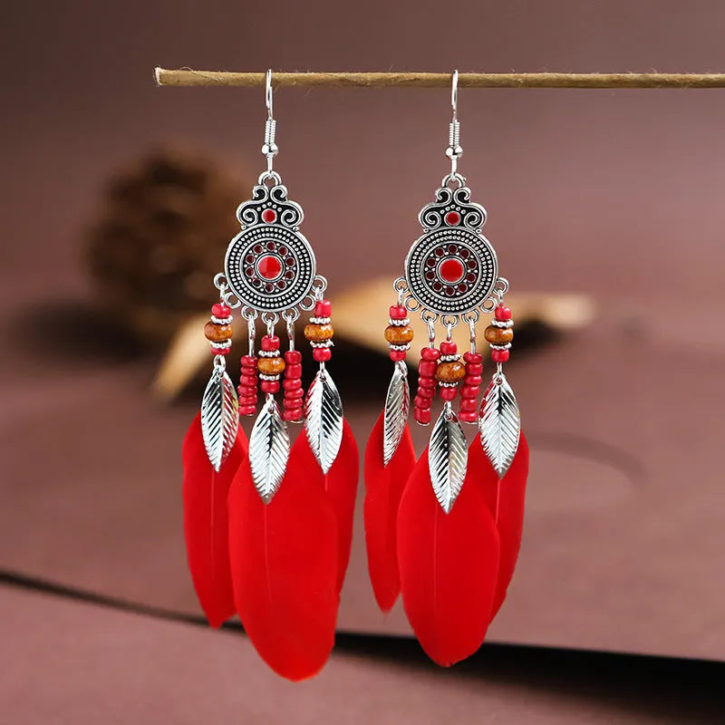 Bohemian style round drop feather earrings with leaf design in alloy, showing electroplated finish.