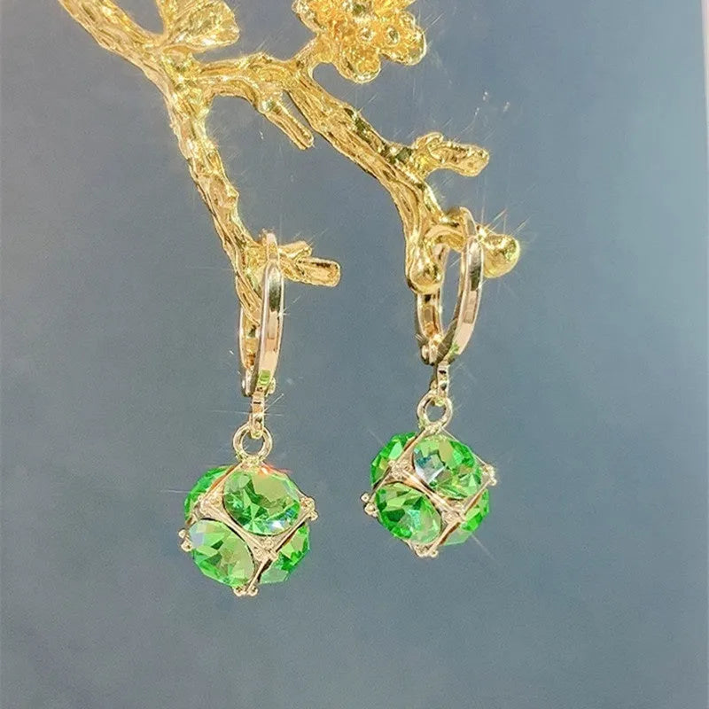 Geometric rose design women's electroplated copper earrings shown in one of the available colour variants.