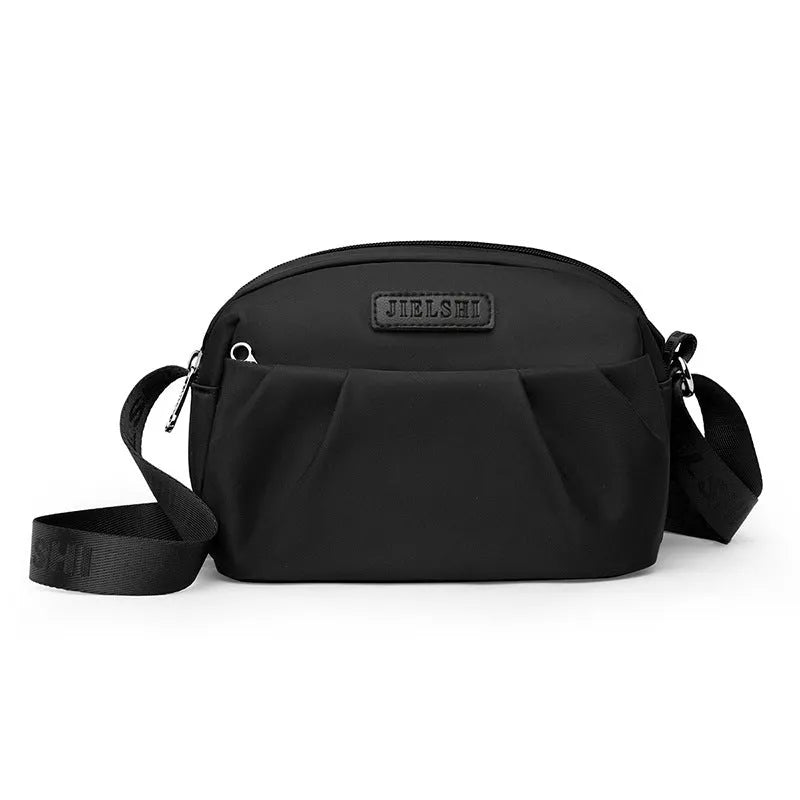 Pleated Oxford cloth shoulder messenger bag in horizontal square shape with cross-body strap