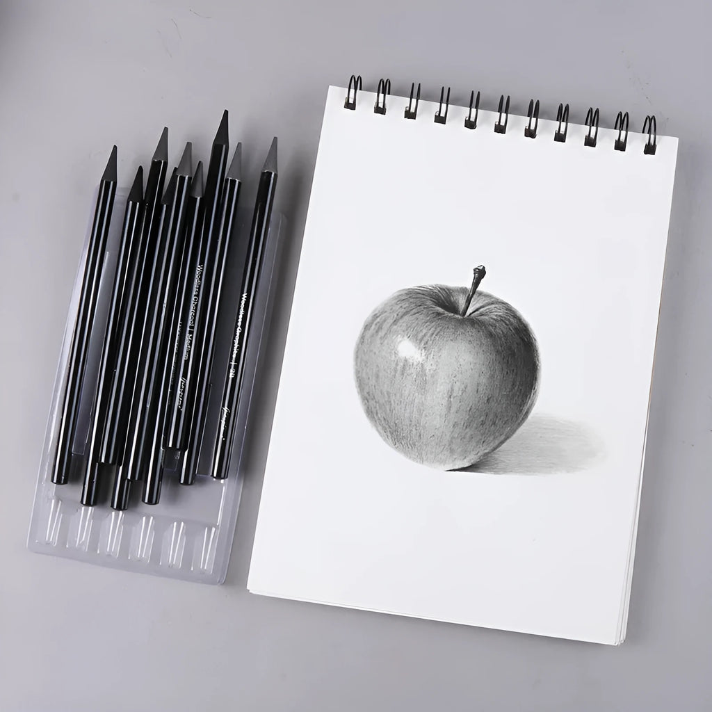 A graphite and carbonised pencil suit on a suction card, showing nine wooden pencils.