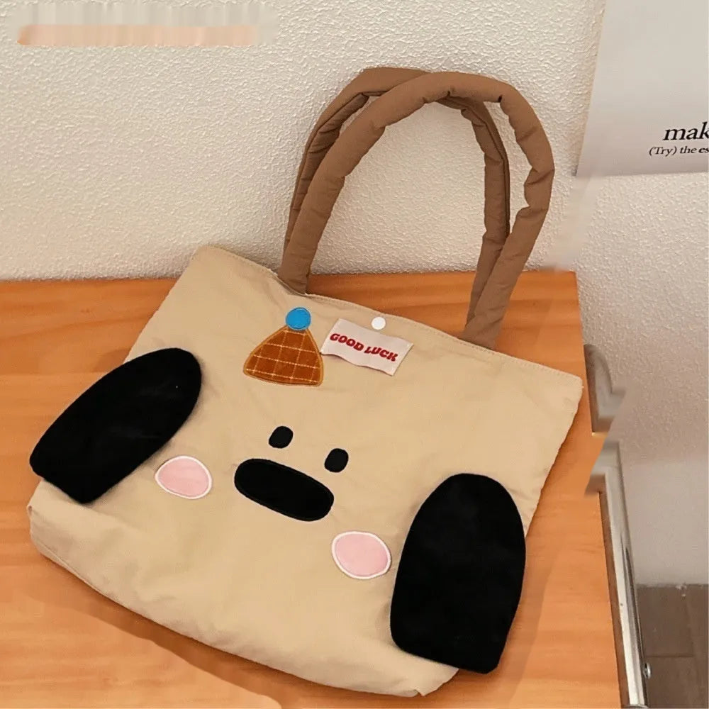 Cartoon print canvas handbag showing colourful design with 30x36x24cm dimensions