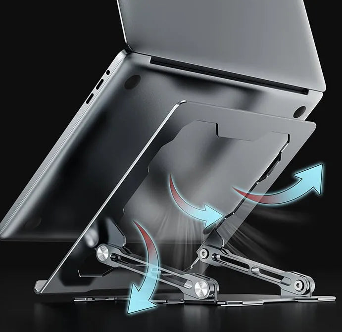 Grey aluminium folding laptop stand shown at an adjustable angle on a wooden desk.