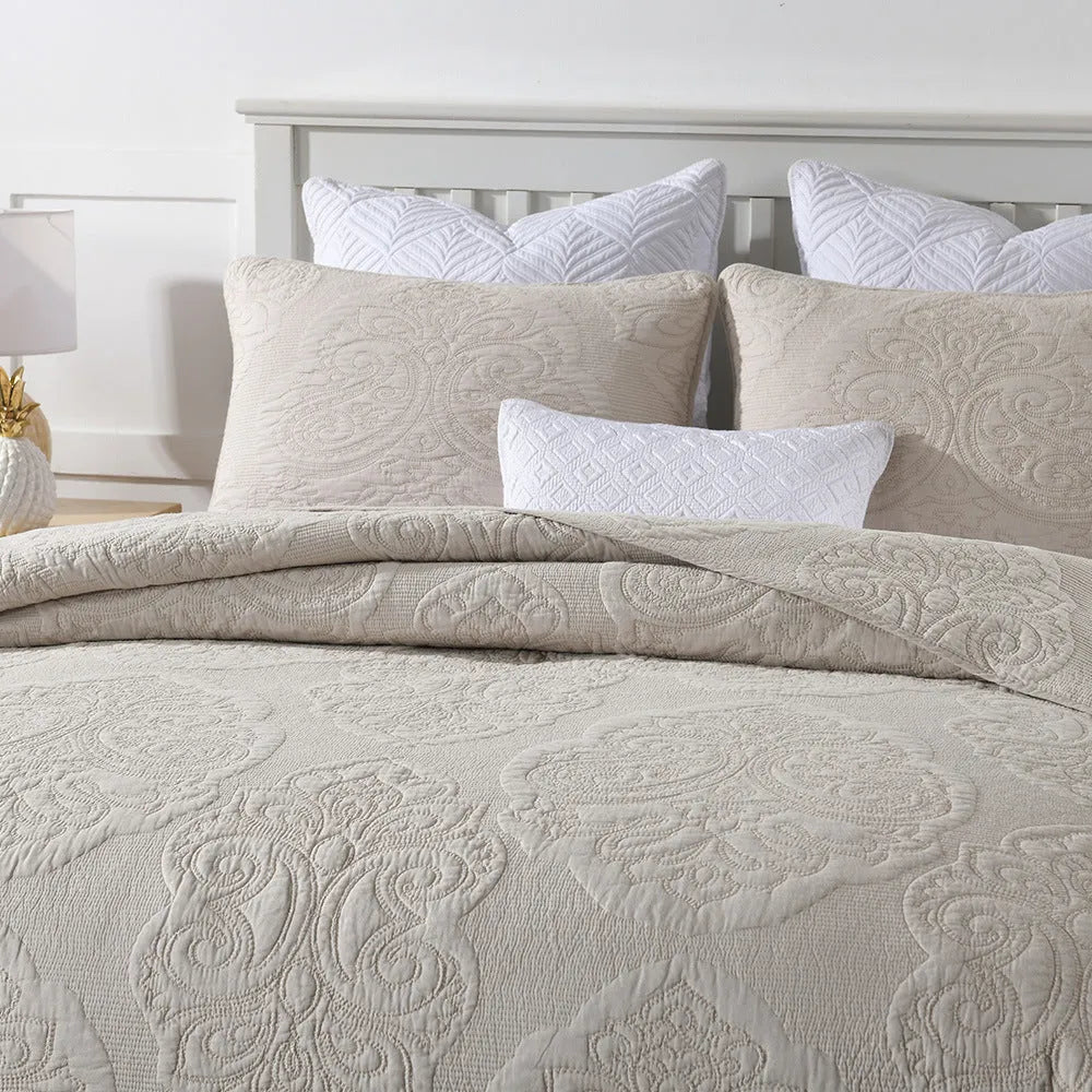 Three-piece pure cotton quilted bed cover set in white with Nordic floral embroidery on a 1.8m bed