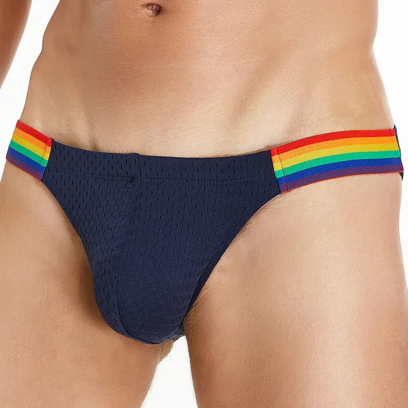 Men's solid colour low waist nylon mesh briefs on a white background