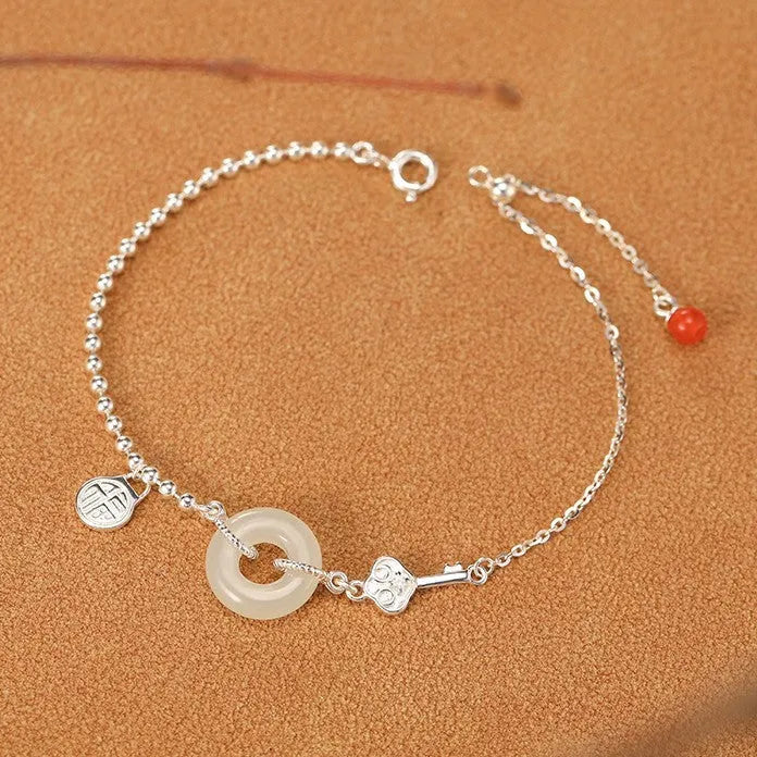Women's Chinese style Hetian jade bracelet in 925 silver with geometric design and electroplated finish