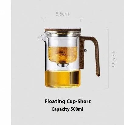 Glass teapot with wooden handle showing magnetic tea separation button and drip-free spout.