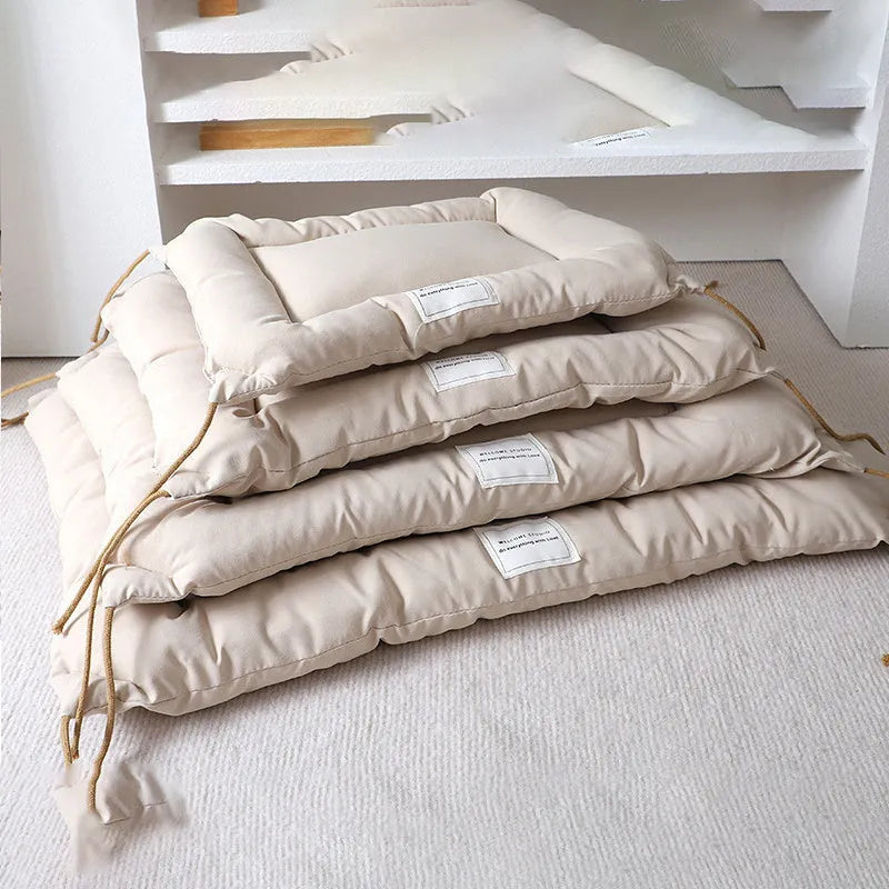 Tied cage cushion pet nest in beige, coffee or orange colours showing four size options for small dogs and cats