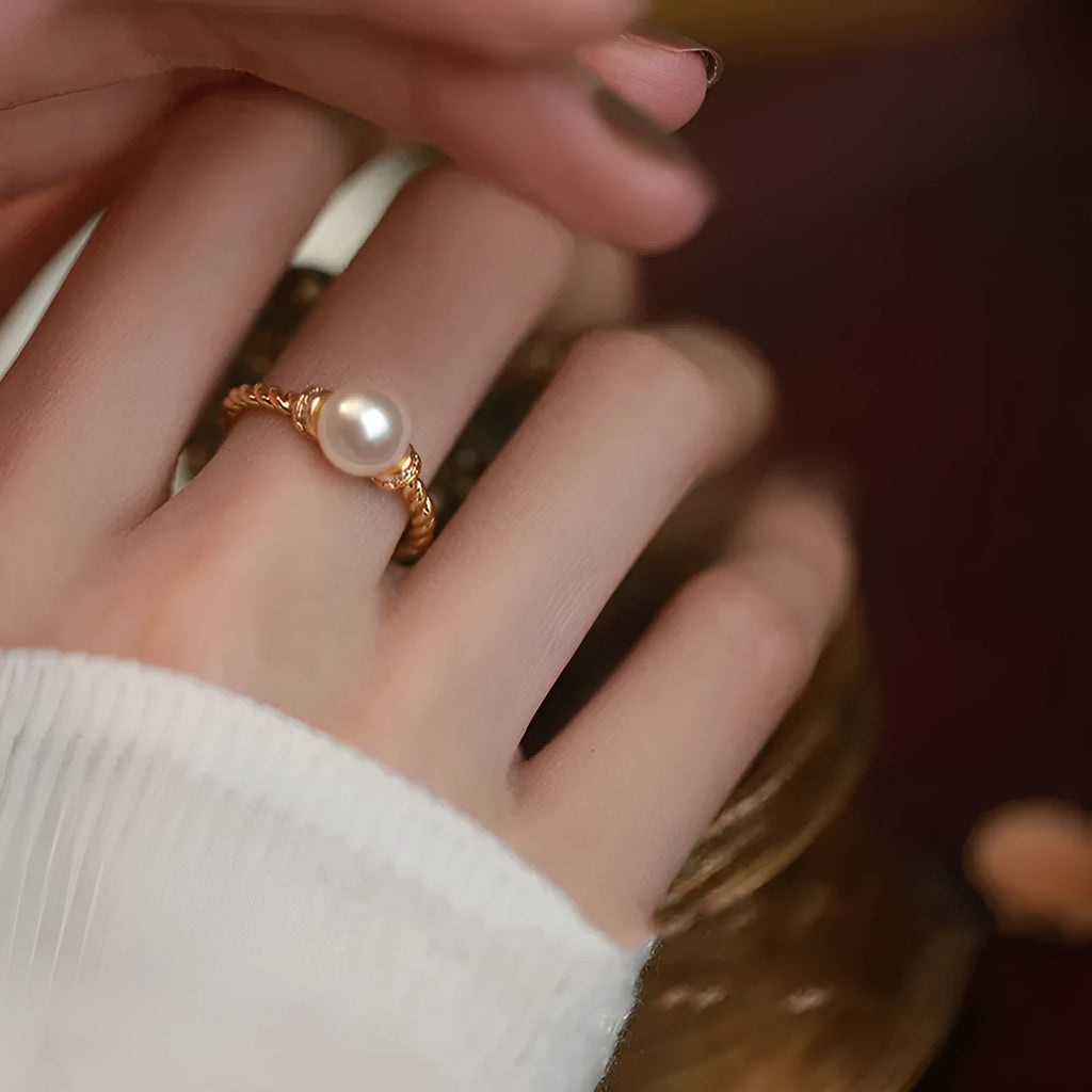 Antique twist pearl ring in copper with adjustable size and geometric design, available in gold or silver colour.