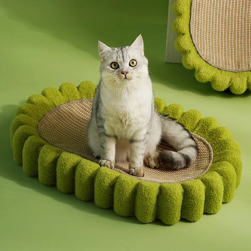 Green oval cat scratcher pad with sisal material and integrated cat bed bowl design