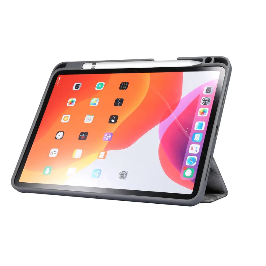 Marbled tri-fold iPad case in dark grey standing upright, showing pen slot and folded stand.
