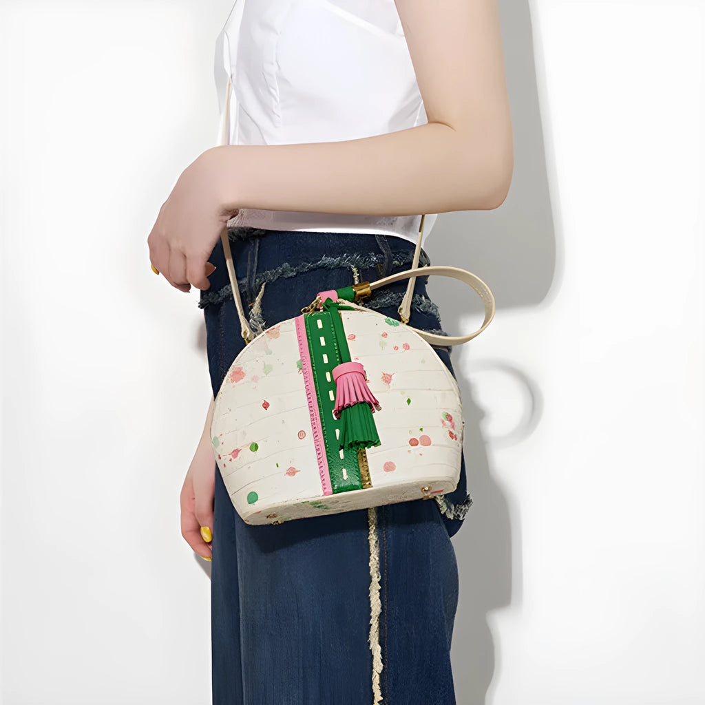 Women's genuine cow leather shell shape tassel handbag in Gypsophila colour with zipper closure