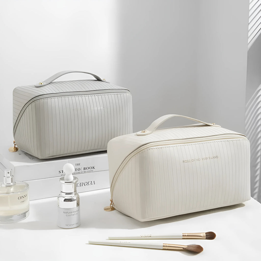 Vertical pattern pillow-shaped cubic makeup bag in PU material for women's travel storage.