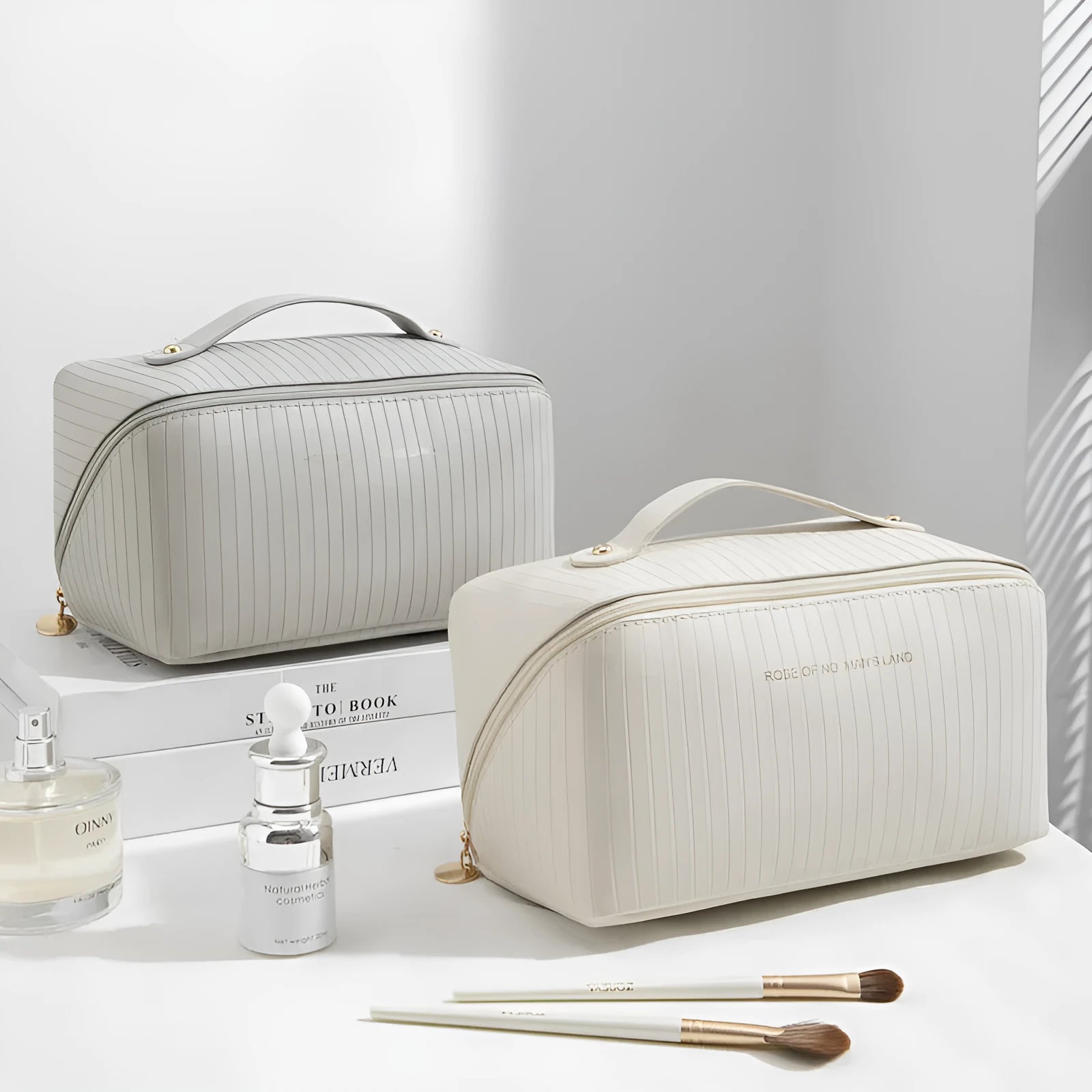 Vertical pattern pillow-shaped cubic makeup bag in PU material for women's travel storage.