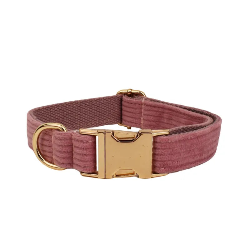 Red corduroy dog collar and leash set with matching vest, bow tie, and poo bag