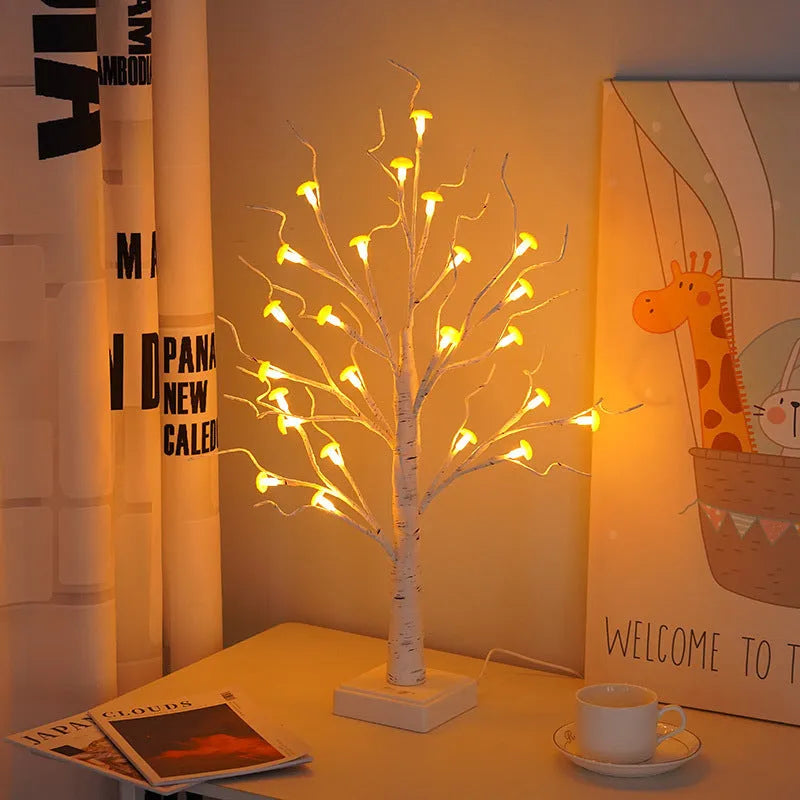 60 cm tall white birch tree LED lamp with small mushroom-shaped flowers glowing with warm light.