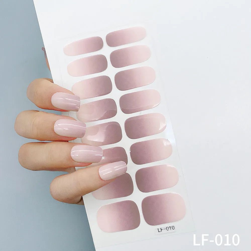 Full sheet of nail art stickers showing 16 different small designs including roses, butterflies, and leopard print patterns.
