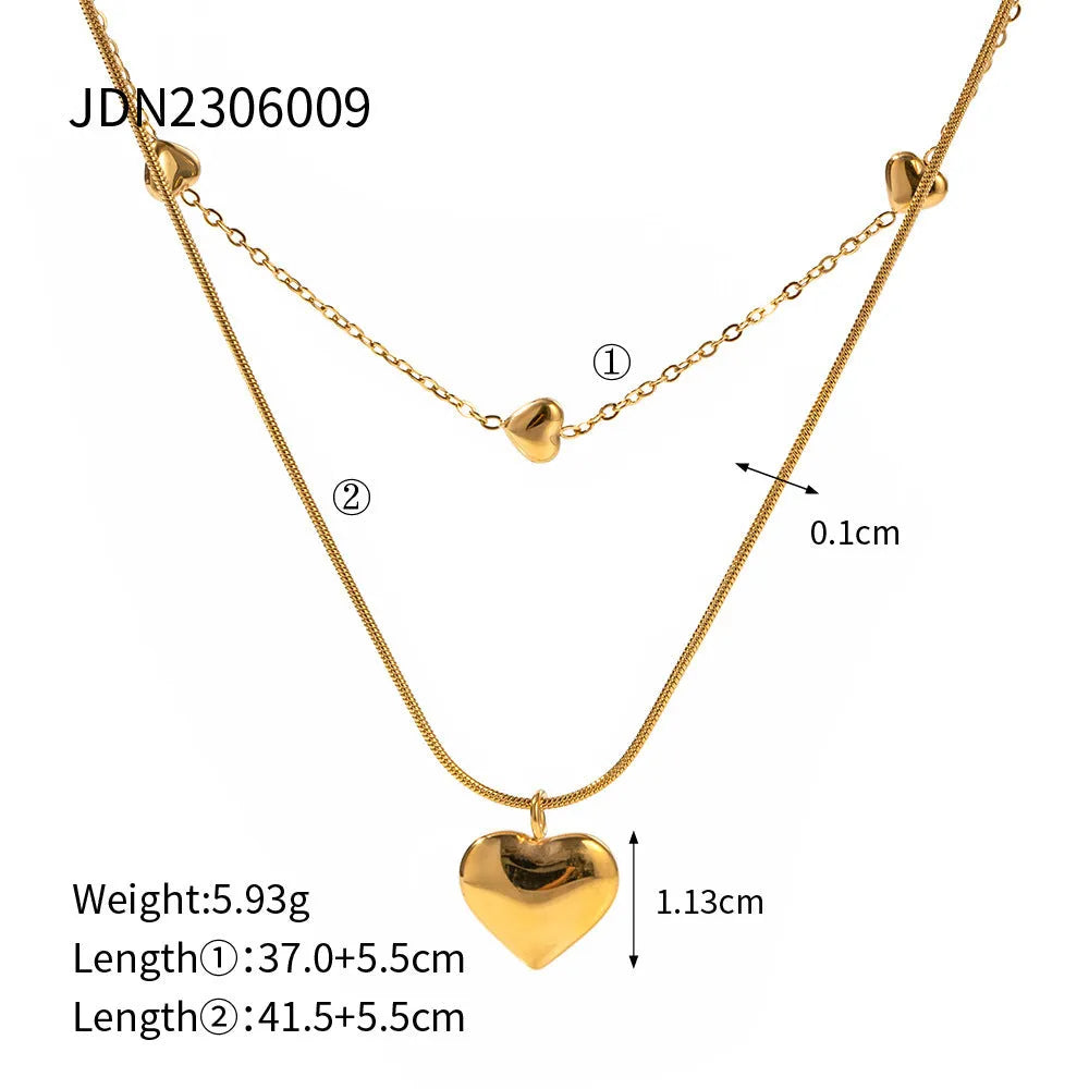 Love double-layer 18K gold-plated collarbone necklace with snake pendant for women on display