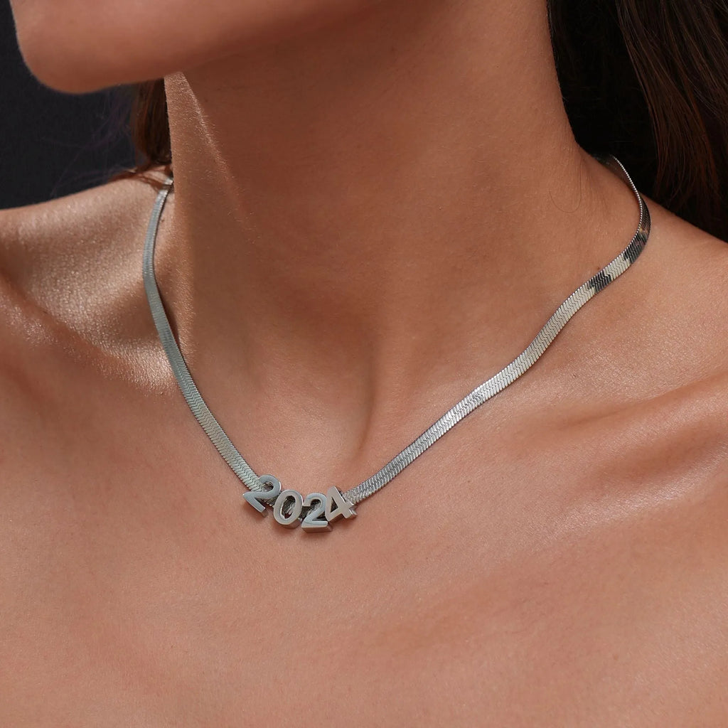 Gold and silver titanium steel necklaces with letter, number, and heart charms on a 40.5cm chain.