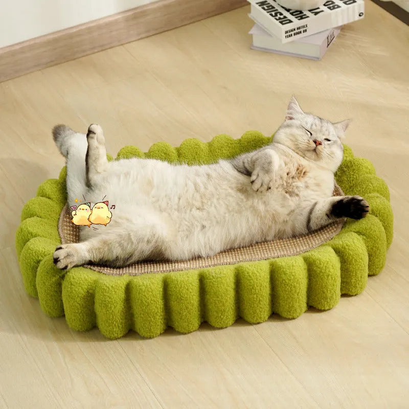 Green oval cat scratcher pad with sisal material and integrated cat bed bowl design