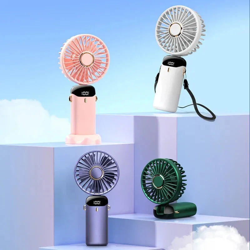 Blue portable handheld fan showing foldable design with digital battery display and removable grill