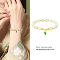 S925 sterling silver bracelet with Hetian jade beads and bamboo leaf charms in gold colour