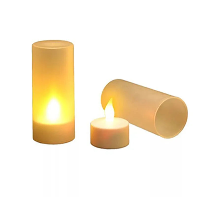 White plastic rechargeable LED candle lamp with yellow glowing flame on a table.