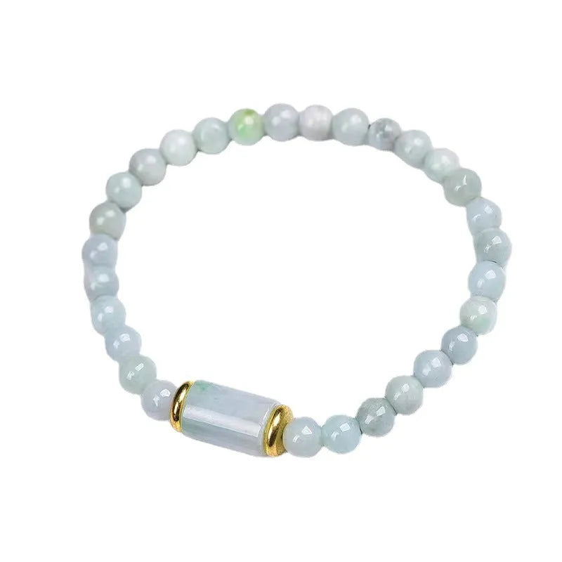 A close-up of a round Myanmar ice jade bead bracelet in emerald colour.
