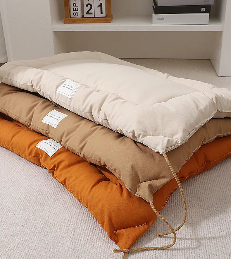 Tied cage cushion pet nest in beige, coffee or orange colours showing four size options for small dogs and cats