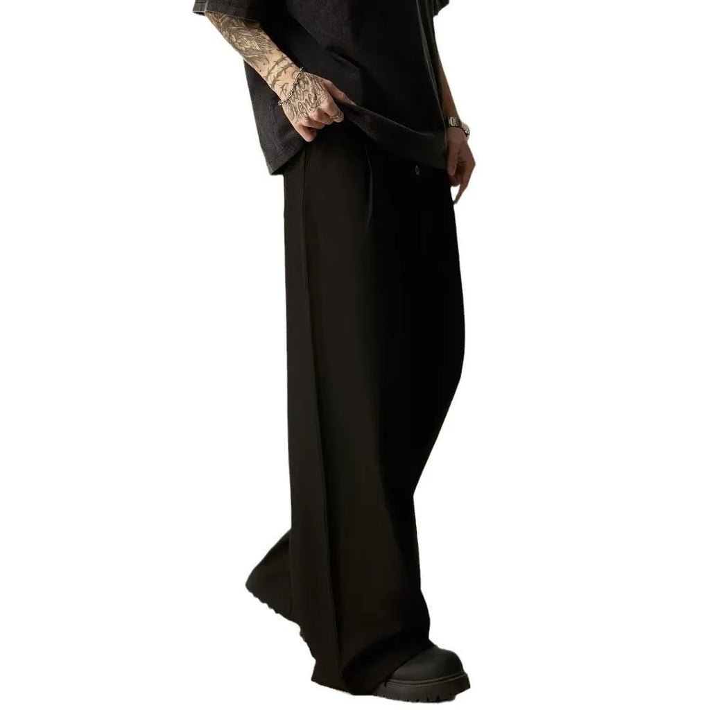 Men's black wide-leg straight-leg casual trousers made from a cotton-polyester blend fabric.